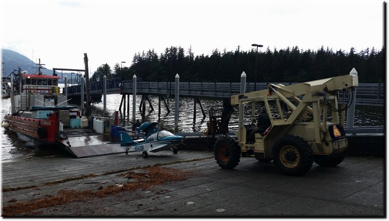 20150728_094142-Damaged amphibious plane with wings removed for transport.jpg